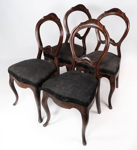 Set of four rococo dining room chairs of mahogany and upholstered with black 
fabric, in great antique condition from around 1880. 
5000m2 showroom.
