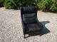 Recliner / wing chair in black leather Danish design from the 1960s stands as a new 5000 m2 showroom