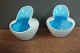 Small tealight cups in two-tones white / light blue from Holmegaard. 5000 m2 
showroom.
