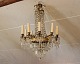 Crystal chandelier from France and the year 1880. The chandelier is in gilded bronze and has been restored.5000m2 showroom.
