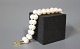 Bracelet of cultured Pearls with a 14ct. gold Lock with four diamonds. 5000m2 showroom.