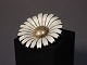 Daisy brooch by A. Michelsen. Gilded 925 sterling and White enamel.5000m2 showroom.
