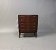 Small chest of drawers with curved front in rosewood from the 1960s.5000m2 showroom.