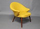 Nanna Ditzel armchair upholstered in yellow fabric and legs of teak.5000m2 showroom.
