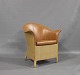 Lounge chair in paper cord and upholstered in Brown leather by Sika Design.5000m2 showroom.