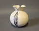 Small ceramic vase with white and grey glaze stamped GE.5000m2 showroom.