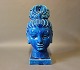 Oriental ceramic head of a woman with a dark blue glaze.5000m2 showroom.