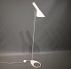 White floor lamp designed by Arne Jacobsen in 1960 and manufactured by Louis Poulsen.5000m2 showroom.