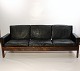 Sofa in rosewood and black leather of danish design from the 1960s.5000m2 showroom.