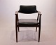 Armchair in rosewood and black leather designed by Erik Kirkegaard from the 1960s.5000m2 showroom.