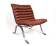 Easy chair, model Ariet, of red leather and steel frame by Arne Norell and Norell Furniture AB.5000m2 showroom.
