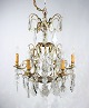 Chandelier of brass and polished prisms from France around the 1920s.5000m2 showroom.