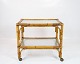 Tray table on wheels of Bamboo and with glass plates from the 1960s.
5000m2 showroom.
