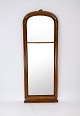 Tall mirror of mahogany from around the 1860s. 
