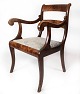 Empire antique armchair of mahogany and upholstered with light fabric from the 
1840s.
