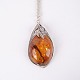 Pendant with silver necklace in silver and amber, unique design