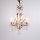 Antique Crystal Chandelier in Gilt Bronze with Louvre Style Decorations 1920s